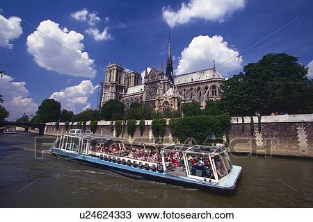Image of a Huge Boat Filled With Tourist on the Seine, the Notre Dame de Paris Visible in the Background, Side View, Paris, France View Large Photo Image Stock Image - Image of a Huge Boat Filled With Tourist on the Seine, the Notre Dame de Paris Visible in the Background, Side View, Paris, France. Fotosearch