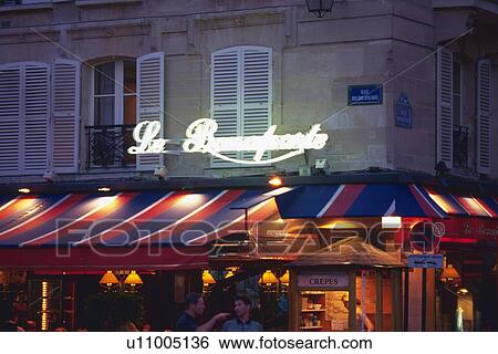 Stock Photograph - Image of a Little Café in the Evening, Paris, France. Fotosearch