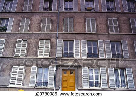 Image of a Parisian Apartment house With a Lot of Windows, Low Angle View, Front View, Paris, France View Large Photo Image Stock Photograph - Image of a Parisian Apartment house With a Lot of Windows, Low Angle View, Front View, Paris, France. Fotosearch