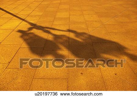 Image of a Shadow of a Streetlamp on a Ground Made of Stone, High Angle View, Paris, France View Large Photo Image Stock Photograph - Image of a Shadow of a Streetlamp on a Ground Made of Stone, High Angle View, Paris, France. Fotosearch