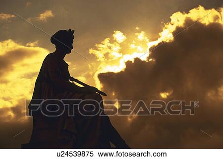 Image of a Statue, Surrounded By Clouds By Sunset, Low Angle View, Side View, Paris, France View Large Photo Image Stock Photography - Image of a Statue, Surrounded By Clouds By Sunset, Low Angle View, Side View, Paris, France. Fotosearch