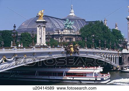 Stock Photo - Image of a Tourist Boat on the Seine Under a Bridge, Side View, Paris, France. Fotosearch