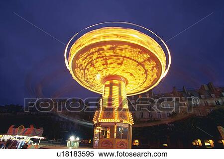 Image of an Illuminated Carrousel Moving, Low Angle View, Long Exposure, Low Angle View, Paris, France View Large Photo Image Stock Photography - Image of an Illuminated Carrousel Moving, Low Angle View, Long Exposure, Low Angle View, Paris, France. Fotosearch