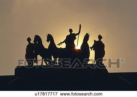 Stock Photo - Image of Several Statues Under a Grey Sky, the Sun Visible in the Background, Front View, Paris, France, Lens Flare. Fotosearch