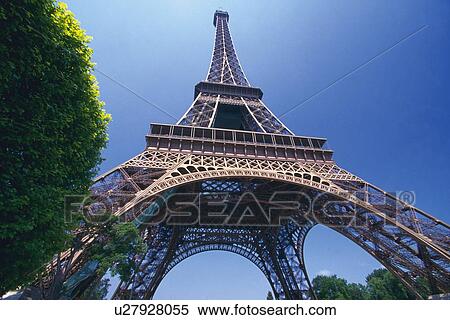 Image of the Eiffel Tower Under a Blue Sky on a Sunny Day, Low Angle View, Paris, France View Large Photo Image Stock Photography - Image of the Eiffel Tower Under a Blue Sky on a Sunny Day, Low Angle View, Paris, France. Fotosearch