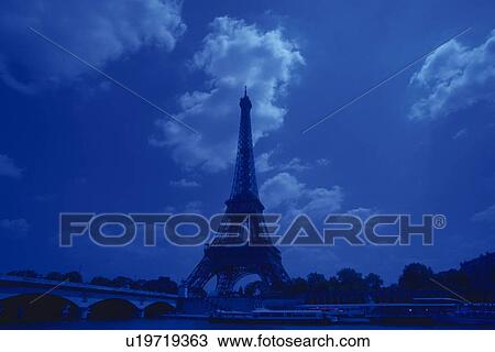 Image of the Eiffel Tower Under a Deep Blue Sky and Some Clouds, Low Angle View, Paris, France View Large Photo Image Stock Image - Image of the Eiffel Tower Under a Deep Blue Sky and Some Clouds, Low Angle View, Paris, France. Fotosearch