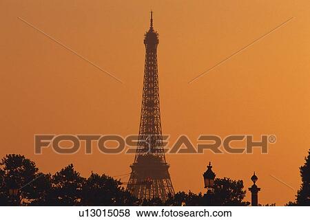 Image of the Eiffel Tower Under an Orange Sky, Front View, Paris, France View Large Photo Image Stock Photo - Image of the Eiffel Tower Under an Orange Sky, Front View, Paris, France. Fotosearch