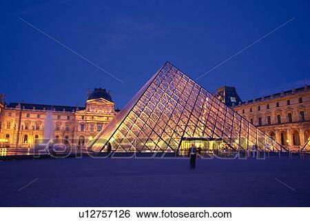 Stock Photograph - Image of the Louvre in the Evening Under a Dark Blue Sky, Front View, Paris, France. Fotosearch