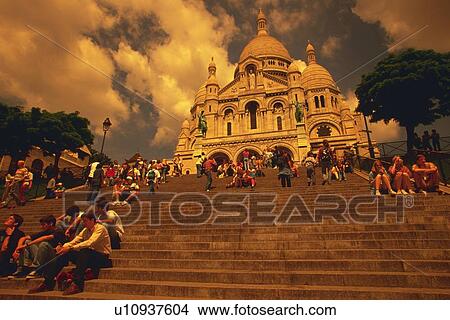 Image of the Sacre-Coeur Under a Blue Sky on a Sunny Day, With Several people Sitting on the Steps In Front of the Cathedral, Low Angle View, Paris, France View Large Photo Image Picture - Image of the Sacre-Coeur Under a Blue Sky on a Sunny Day, With Several people Sitting on the Steps In Front of the Cathedral, Low Angle View, Paris, France. Fotosearch