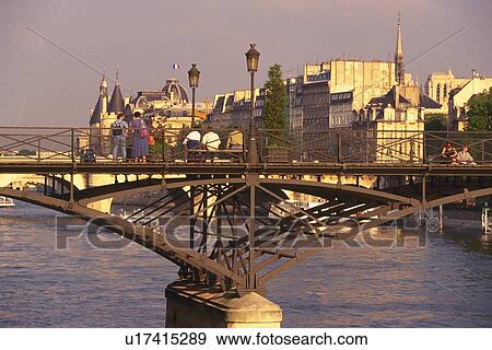 Image of Two People Standing on a Bridge Over the Seine By Sunset, Side View, Rear View, Paris, France View Large Photo Image Stock Photo - Image of Two People Standing on a Bridge Over the Seine By Sunset, Side View, Rear View, Paris, France. Fotosearch