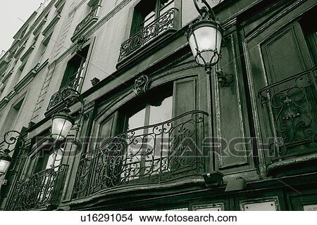 Picture - Closed Up Image of an Parisian Apartment House With Two Lamps on Each Window, Low Angle View, Side View, Paris, France. Fotosearch