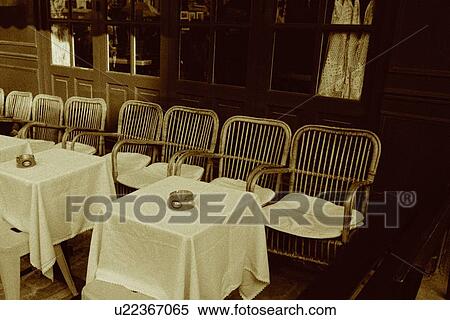 Closed Up Image Of Several Chairs And Tables At A Cafe High Angle