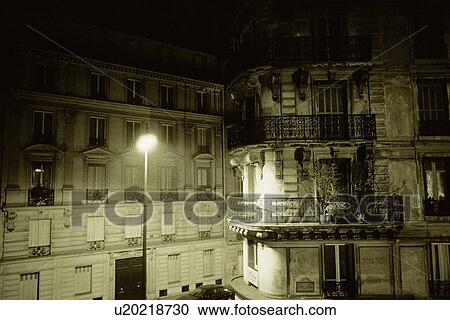 Closed Up Image of Several Parisian Apartment Houses By Night, a Single Streetlamp Shining, Front View, Paris, France View Large Photo Image Stock Image - Closed Up Image of Several Parisian Apartment Houses By Night, a Single Streetlamp Shining, Front View, Paris, France. Fotosearch