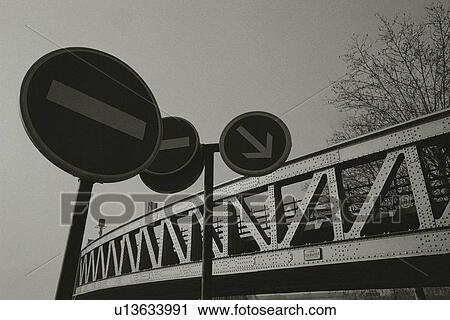 Closed Up Image of Several Road Sign Next to a Bridge, Low Angle View, Paris, France View Large Photo Image Stock Image - Closed Up Image of Several Road Sign Next to a Bridge, Low Angle View, Paris, France. Fotosearch