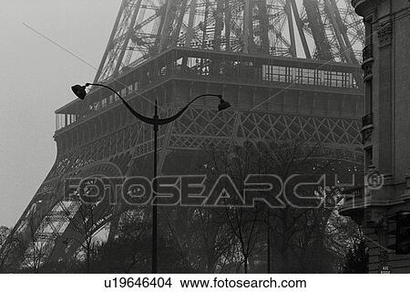 Closed Up Image of the Eiffel Tower, a Street Lamp Standing In Front of It, Front View, Paris, France View Large Photo Image Picture - Closed Up Image of the Eiffel Tower, a Street Lamp Standing In Front of It, Front View, Paris, France. Fotosearch