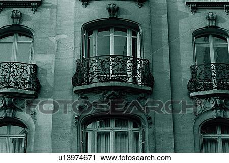 Stock Image - Closed Up Image of Three Balconies of a Parisian Apartment House, Low Angle View, Front View, Paris, France. Fotosearch