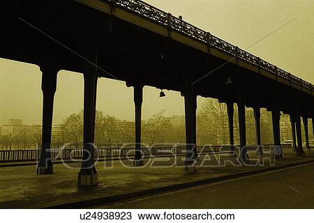 Stock Image - Image of a Bridge Over Some Water, With Several Trees in the Background, Low Angle View, Side View, Paris, France. Fotosearch