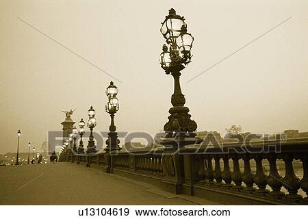 Stock Photo - Image of a Decorative Bridge in Paris Under a Grey Sky, Side View, Paris, France. Fotosearch