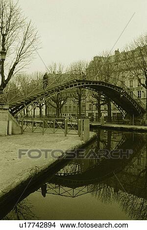 Image of a Little Bridge Over a Little Rover Surrounded By Apartment Houses, Side View, Paris, France View Large Photo Image Picture - Image of a Little Bridge Over a Little Rover Surrounded By Apartment Houses, Side View, Paris, France. Fotosearch