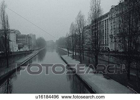Stock Photograph - Image of a Little River With Several Trees and Apartment Houses at the Side, Front View, Paris, France. Fotosearch
