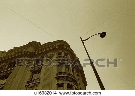 Picture - Image of a Parisian Apartment House Under a Grey Sky, a Streetlamp Right Next to it, Low Angle View, Paris, France. Fotosearch