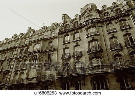 Image of a Parisian Apartment House Under a Grey Sky, Low Angle View, Paris, France View Large Photo Image Stock Image - Image of a Parisian Apartment House Under a Grey Sky, Low Angle View, Paris, France. Fotosearch