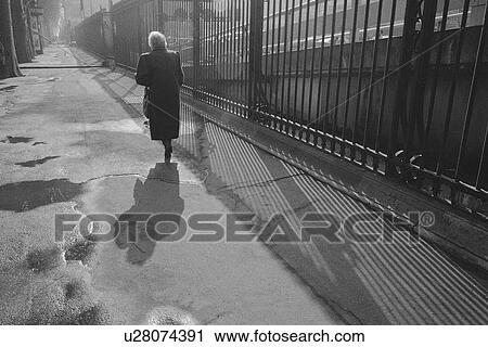 Image of a Senior Adult Woman Walking Down a Street in Paris, Rear View, Paris, France View Large Photo Image Stock Image - Image of a Senior Adult Woman Walking Down a Street in Paris, Rear View, Paris, France. Fotosearch