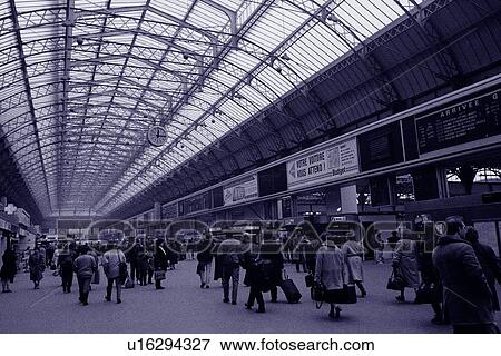 Stock Photo - Image of a Train Station in Paris With a Large Group of Passengers in It, Side View, Rear View, Paris, France. Fotosearch