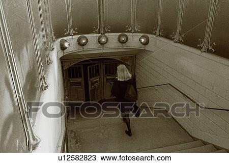 Image of a Woman Walking Into a Subway Entrance, High Angle View, Paris, France View Large Photo Image Stock Image - Image of a Woman Walking Into a Subway Entrance, High Angle View, Paris, France. Fotosearch