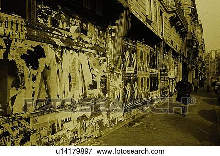Image of a Woman Walking Next to a Wall Full With Old Posters, Rear View, Paris, France View Large Photo Image Stock Photo - Image of a Woman Walking Next to a Wall Full With Old Posters, Rear View, Paris, France. Fotosearch