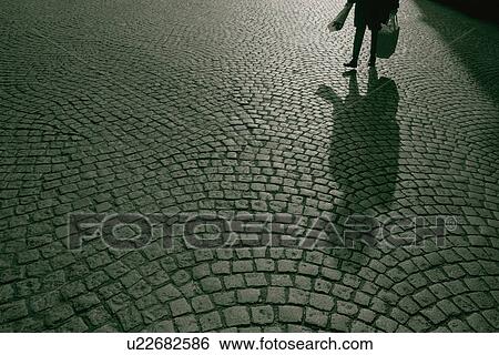 Stock Photograph - Image of Someone Walking Over a Ground Made of Stone, High Angle View, Paris, France. Fotosearch