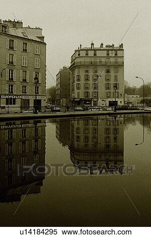 Stock Photography - Image of Two Parisian Apartment Houses Right by the Seine, the Houses Reflecting in the Water, Front View, Paris, France. Fotosearch