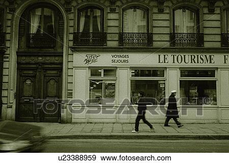 Stock Photo - Image of Two People Walking in the Streets of Paris, Side View, Blurred Motion, Paris, France. Fotosearch