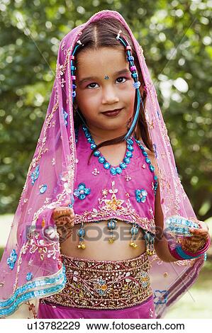 Close-up of a girl in traditional clothing View Large Photo Image Stock Photo - Close-up of a girl in traditional clothing. Fotosearch