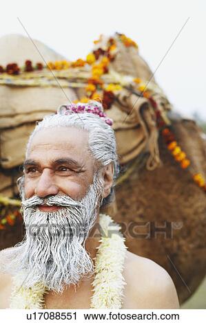 Close-up of a priest smiling View Large Photo Image Stock Image - Close-up of a priest smiling. Fotosearch