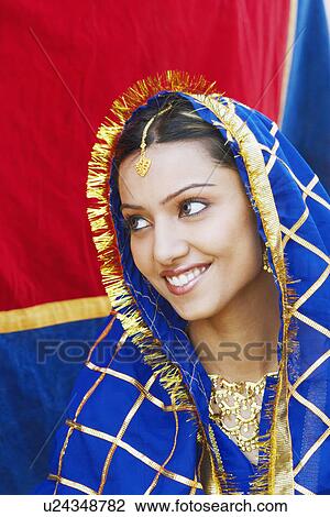 Close-up of a young woman smiling View Large Photo Image Stock Image - Close-up of a young woman smiling. Fotosearch