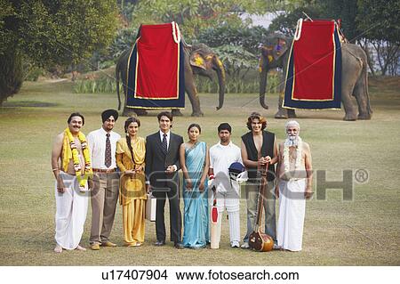 Group of people standing in the garden View Large Photo Image Picture - Group of people standing in the garden. Fotosearch