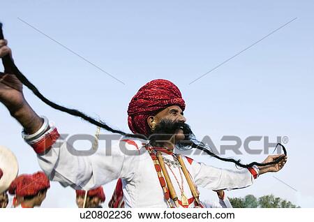 Low angle view of a mature man holding his mustaches, Elephant Festival, Jaipur, Rajasthan, India View Large Photo Image Stock Photograph - Low angle view of a mature man holding his mustaches, Elephant Festival, Jaipur, Rajasthan, India. Fotosearch