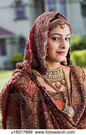 Stock Photo - Portrait of a bride in a traditional wedding dress. Fotosearch