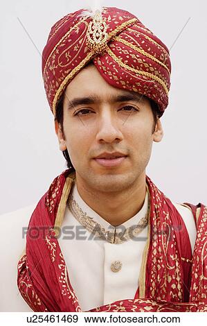 Portrait of a groom in a traditional wedding outfit View Large Photo Image Stock Photo - Portrait of a groom in a traditional wedding outfit. Fotosearch