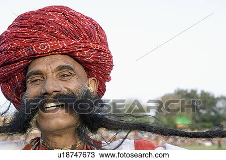 Stock Image - Portrait of a mature man smiling, Elephant Festival, Jaipur, Rajasthan, India. Fotosearch
