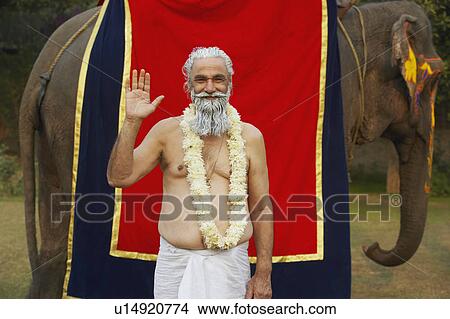 Portrait of a priest greeting View Large Photo Image Picture - Portrait of a priest greeting. Fotosearch
