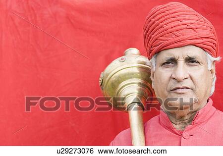 Portrait of a senior man carrying a weapon on his shoulder, Jaipur, Rajasthan, India View Large Photo Image Stock Photograph - Portrait of a senior man carrying a weapon on his shoulder, Jaipur, Rajasthan, India. Fotosearch