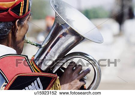 Rear view of a man playing the tuba, Jaipur, Rajasthan, India View Large Photo Image Stock Image - Rear view of a man playing the tuba, Jaipur, Rajasthan, India. Fotosearch