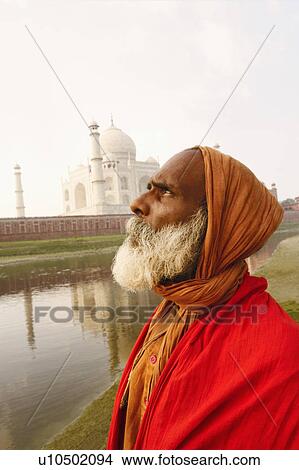 Side profile of a priest on the riverbank, Taj Mahal, Agra, Uttar Pradesh, India View Large Photo Image Picture - Side profile of a priest on the riverbank, Taj Mahal, Agra, Uttar Pradesh, India. Fotosearch
