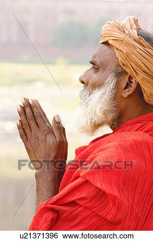 Side profile of a sadhu praying View Large Photo Image Stock Photograph - Side profile of a sadhu praying. Fotosearch
