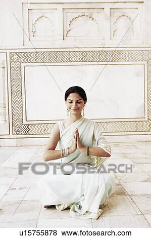 Young woman sitting in a prayer position in a mausoleum, Taj Mahal, Agra, Uttar Pradesh, India View Large Photo Image Stock Photo - Young woman sitting in a prayer position in a mausoleum, Taj Mahal, Agra, Uttar Pradesh, India. Fotosearch