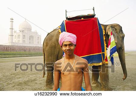 Close-up of a young man smiling, Taj Mahal, Agra, Uttar Pradesh, India View Large Photo Image Stock Image - Close-up of a young man smiling, Taj Mahal, Agra, Uttar Pradesh, India. Fotosearch