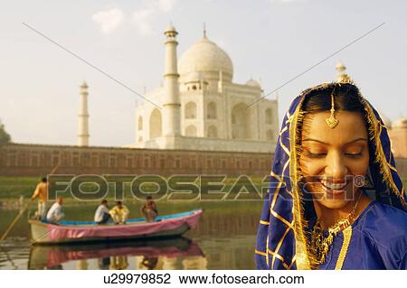 Close-up of a young woman smiling, Taj Mahal, Agra, Uttar Pradesh, India View Large Photo Image Stock Image - Close-up of a young woman smiling, Taj Mahal, Agra, Uttar Pradesh, India. Fotosearch