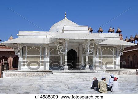 Stock Photo - Four people sitting in front of a dargah, Dargah Of Sheikh Salim Chisti, Fatehpur Sikri, Uttar Pradesh, India. Fotosearch